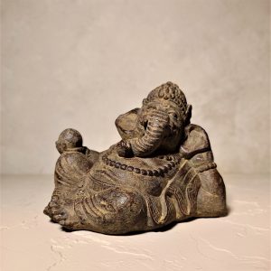 Relaxed Ganesha statue hand-painted in Bali – symbolic spiritual table decor